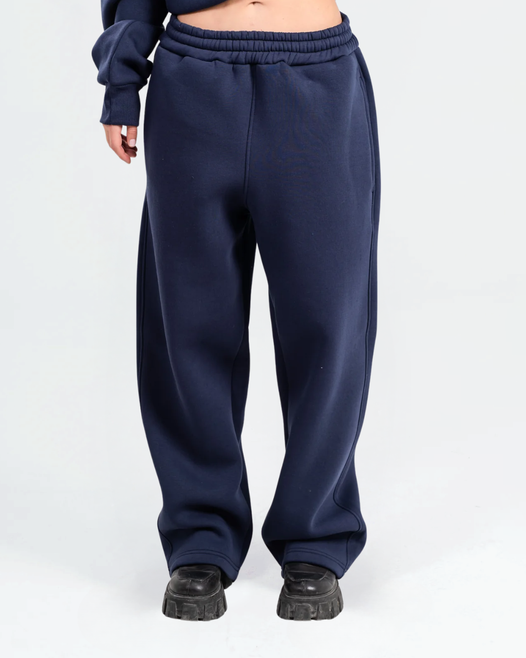 Female model wearing Navy Baggy Sweatpants